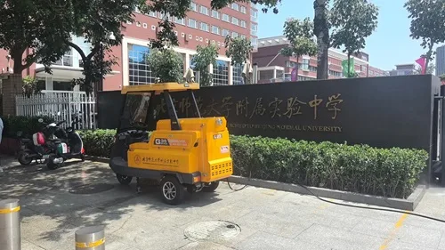 NanboG35 Electric High-Pressure Washing Vehicle serving a school