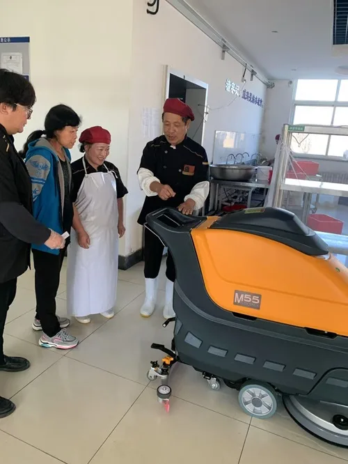 NanboM55 Walk-behind Floor Scrubber serving a company in Weihai